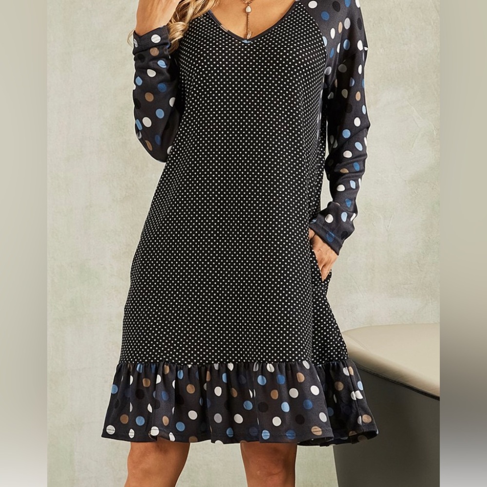 Black and white polka dot ruffle hem v neck dress.